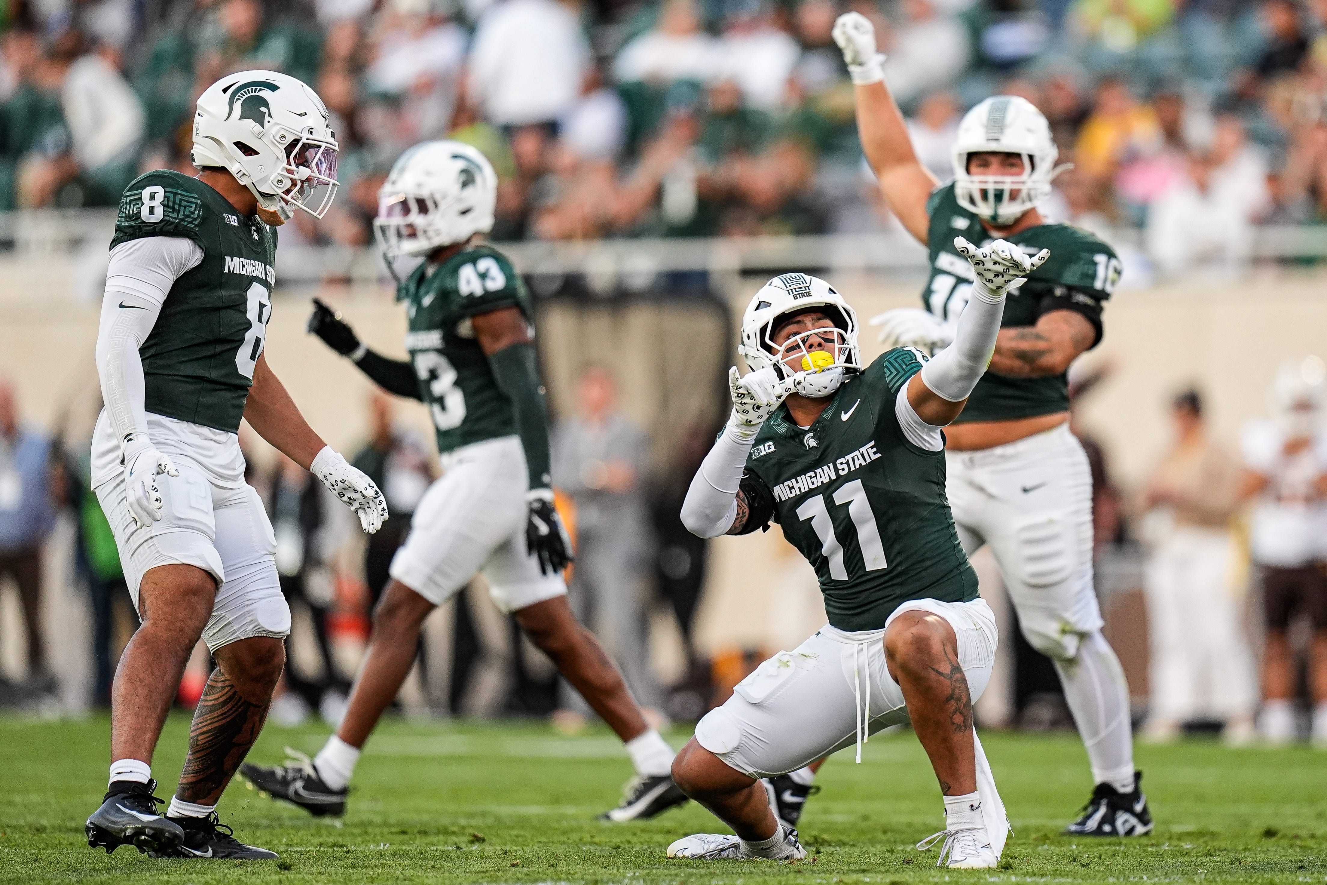 2025-08-30T005637Z_251959364_MT1USATODAY26957035_RTRMADP_3_MICHIGAN-STATE-EDGE-ANELU-LAFAELE-11-CELEBRATES-A-TACKLES.JPG