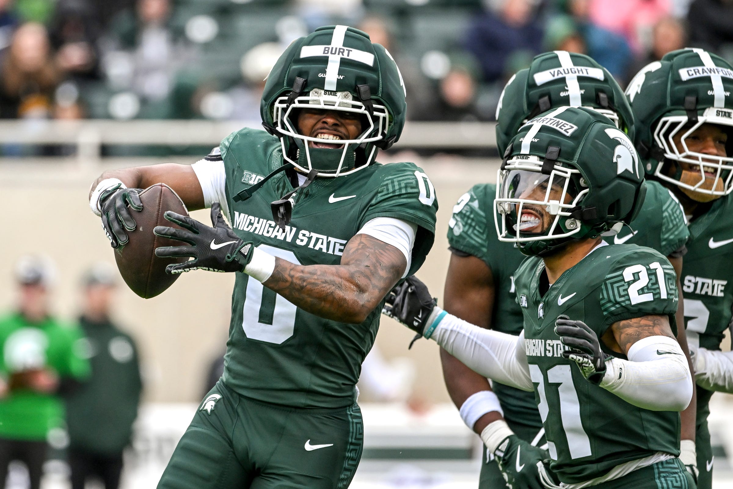 2026-04-18T201148Z_1095282765_MT1USATODAY28759728_RTRMADP_3_MICHIGAN-STATE-S-NIJHAY-BURT-LEFT-CELEBRATES-HIS.JPG