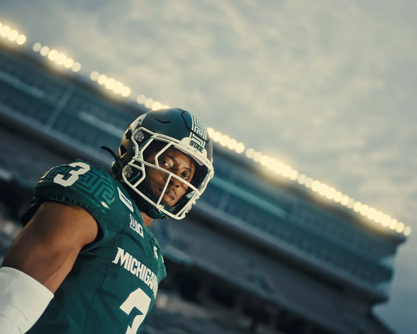 EXCLUSIVE: Fan feedback led MSU to move MSUFCU logo from front of football helmet article image about Michigan State Football