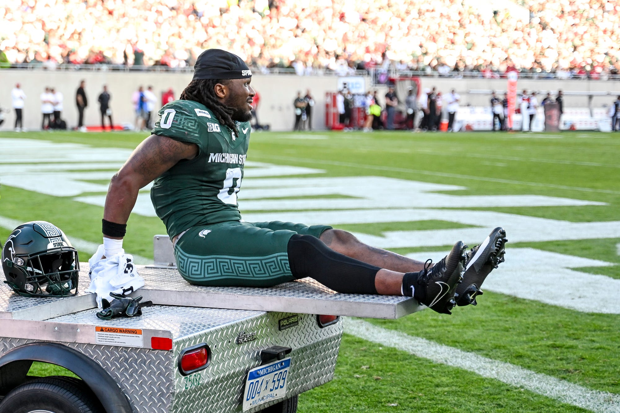 2026-09-26T232516Z_1675233585_MT1USATODAY29925832_RTRMADP_3_MICHIGAN-STATE-S-CAM-EDWARDS-LEAVES-THE-FIELD-ON-A-CART.JPG